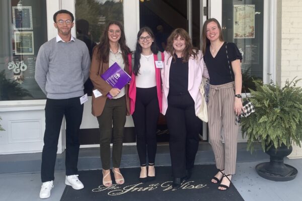 a group of people standing in front of a door