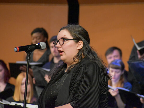 a person singing into a microphone